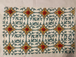 Teal & Gold Lattice with Red Pom‑Pom Accents