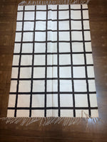 black-and-white checkered woven rug