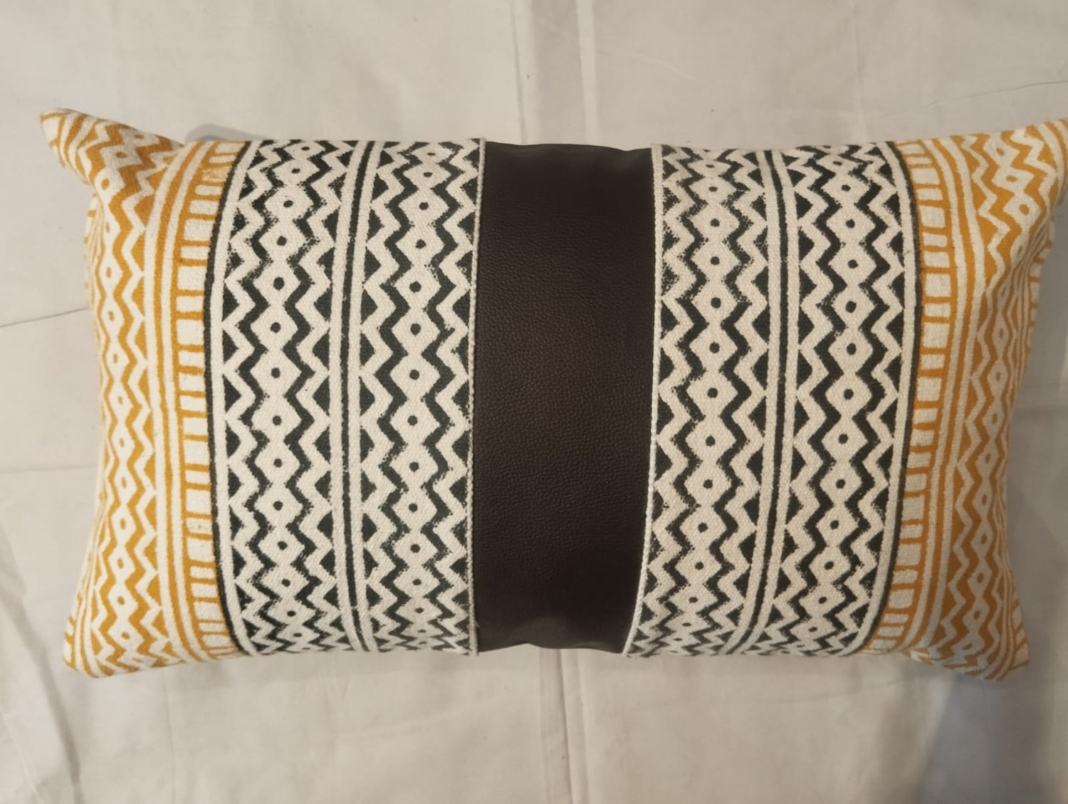 Aztec‑Inspired Yellow & Black Geometric Striped Cushion Cover with Brown Leather Centre Panel