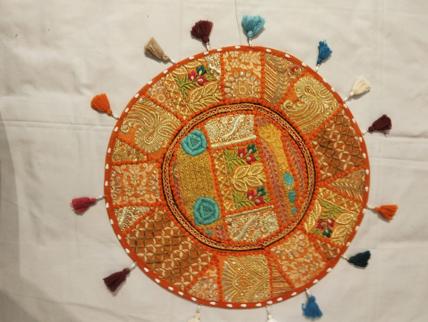 Vibrant Jaipur Orange Embroidered Round Cushion Cover with Gold Zari & Multicolor Tassels