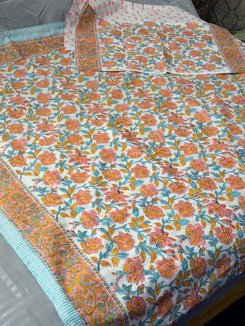 Vibrant Floral Block‑Printed Cotton Bedsheet with Pink & Blue Border