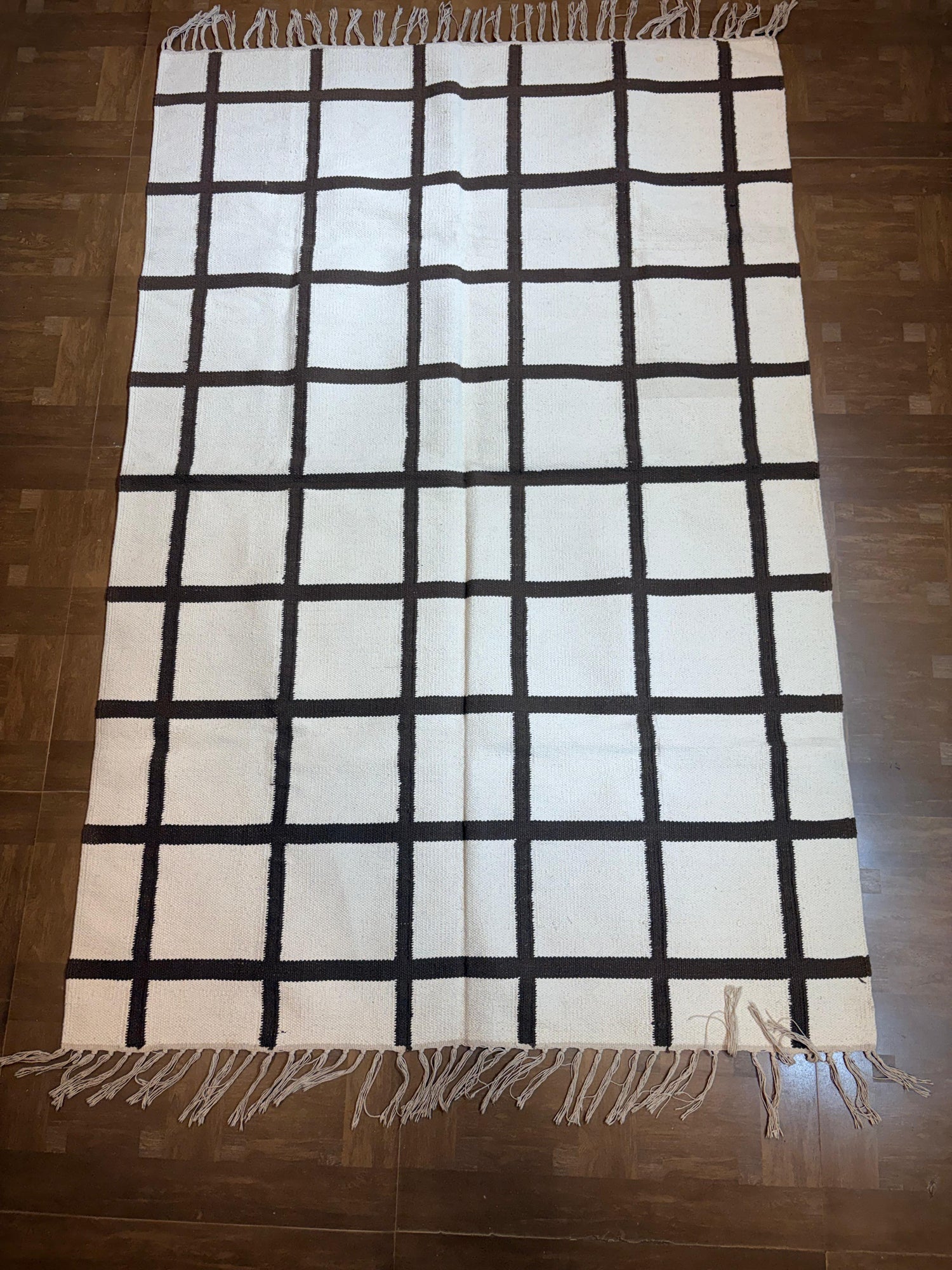 black-and-white checkered woven rug
